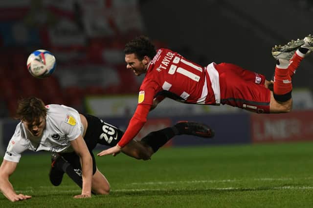 Jon Taylor tumbles during the win over Portsmouth. Picture: Howard Roe/AHPIX