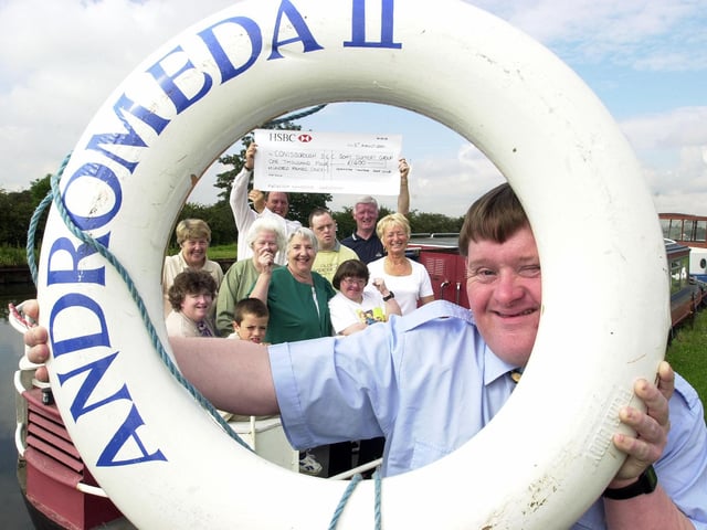 In 2000 Doncaster Town Moor Golf Club presented £1,400 to Conisbrough Social Education centre, to put towards the re-fit of its canal boat Andromeda. Our picture shows Neil Cooper (front), with Jim Pickersgill (back, left), Chairman of the Conisbrough SEC Boat Support Group, receiving the cheque from Lol Sanderson (back, right), president of the Golf Club and the rest of the presentation party. The boat is moored at the Blue Water Marina, Thorne.
