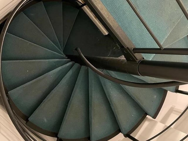A spiral staircase linking floors in the building.
