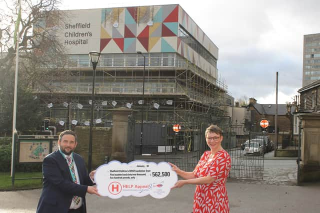 John Armstrong, CEO of The Children's Hospital Charity, presents the donation to Ruth Brown, Chief Executive of Sheffield Children's NHS Foundation Trust on behalf of the HELP Appeal.