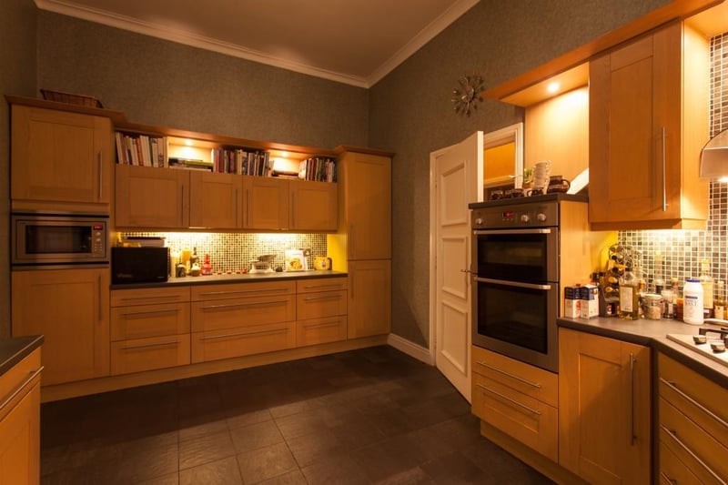 The spacious kitchen has several integrated appliances.