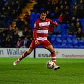 Harrison Biggins slots home the opening goal.