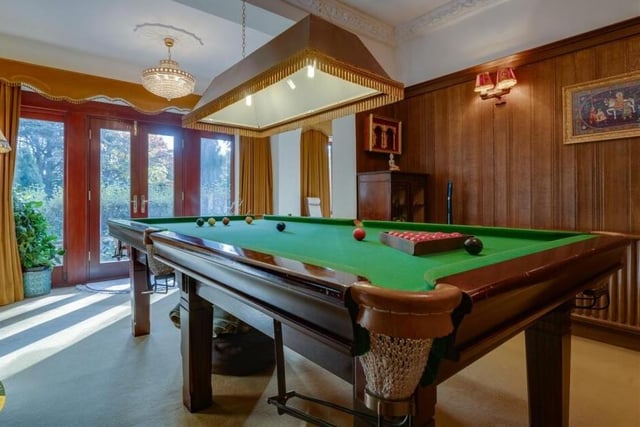 A snooker room, with doors leading outside.