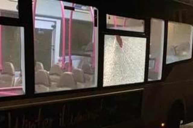 Bus services were cancelled after yobs threw a brick through a bus window.