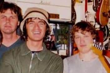 Noel Gallagher on a visit to Doncaster's Music Ground vintage guitar store in the 1990s, alongside a young Michael Price (right). Photo: Michael Price.