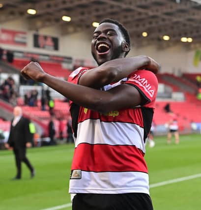 Mo Faal celebrates another home win for Doncaster.