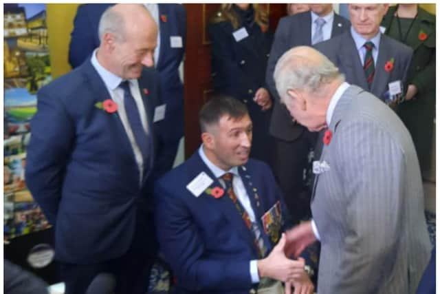 King Charles meets Ben Parkinson at the Mansion House.