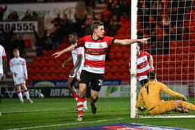 Doncaster's Joe Ironside scores and celebrates the opener. (Pic: Liam Ford/AHPIX LTD)