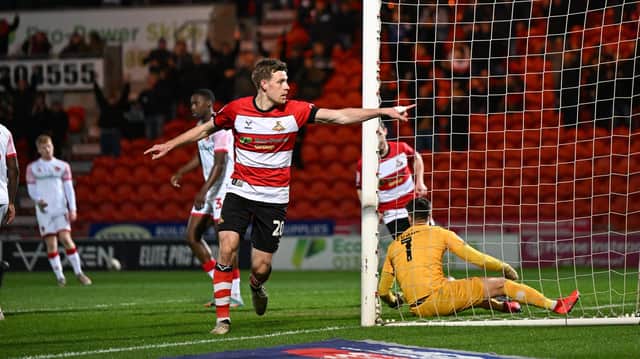 Doncaster's Joe Ironside scores and celebrates the opener. (Pic: Liam Ford/AHPIX LTD)