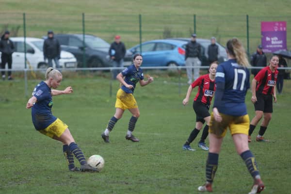 Phoebe Sneddon shoots but is denied by the crossbar. Photo: Julian Barker