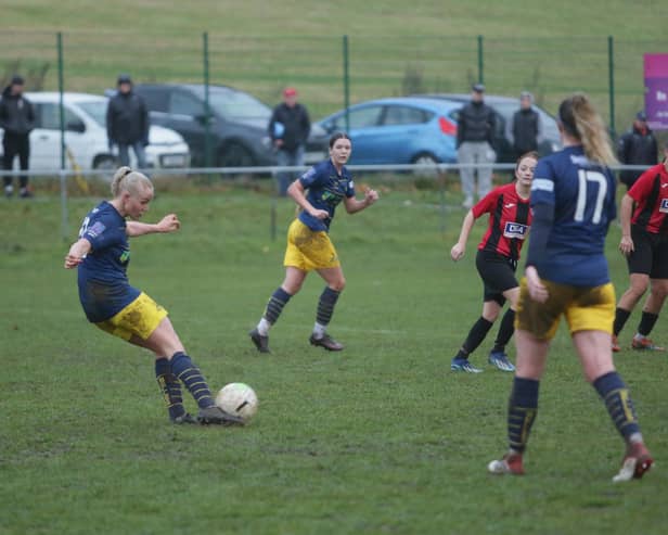 Phoebe Sneddon shoots but is denied by the crossbar. Photo: Julian Barker