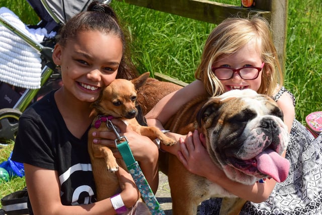Rhianna Ibrahim (12) (left) with Princess and Madeline Cranney (7) with Winston at the Dogs Day Out in 2018.