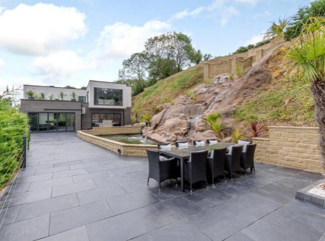 The stunning outdoor area offers a wealth of space for entertaining, with several areas available to relax.