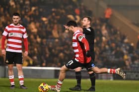 Jordan Gibson was sent off at Colchester by referee James Durkin (background).