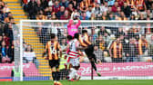 Doncaster's Jonathan Mitchell catches under pressure against Bradford City. Photo: Howard Roe/AHPIX LTD.