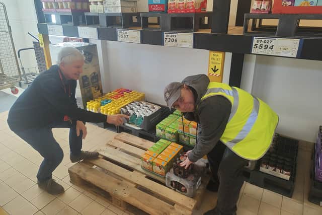 Brian Green, who works at Aspire to Be, alongside service user, Tim Hinsley in the new warehouse area