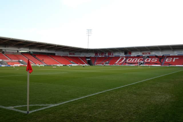 Three fans ran onto the pitch illegally during Doncaster Rovers' match against Lincoln City.