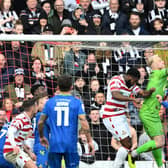 Jonathan Mitchell punches the ball clear against Grimsby.