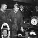 3rd June 1938: Fireman T H Bray on the left and next to him Driver R J Duddington who made history by driving the LNER locomotive 'Mallard' at 125mph. They are in the dynamometer car at Kings Cross station, London studying the instruments which recorded the record-breaking feat. (Photo by Fox Photos/Getty Images)