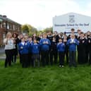 Pupils and staff at Doncaster School for the Deaf signing ‘Good’.