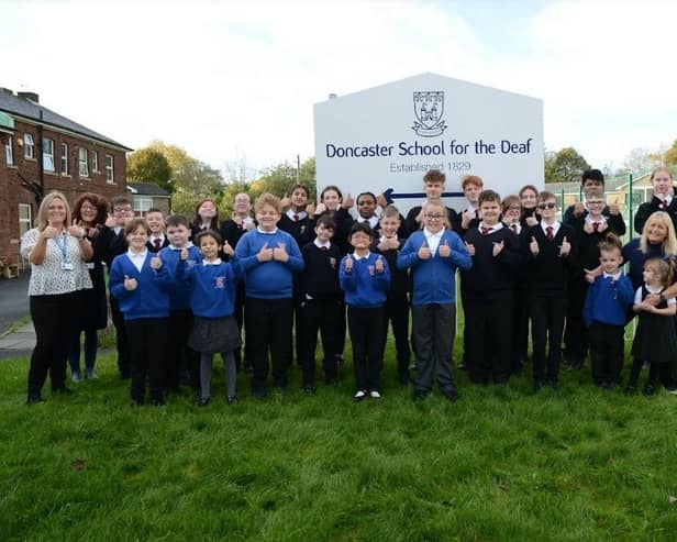 Pupils and staff at Doncaster School for the Deaf signing ‘Good’.