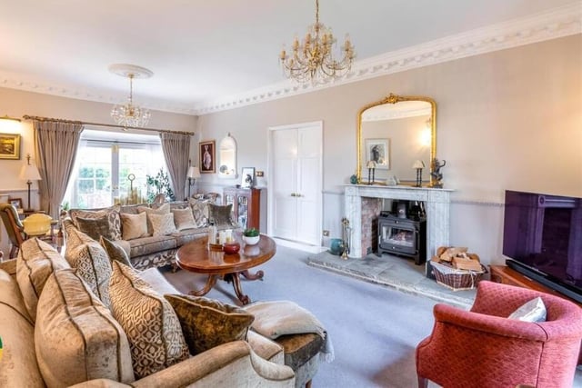 The lounge, with feature fireplace and multi-fuel burner.