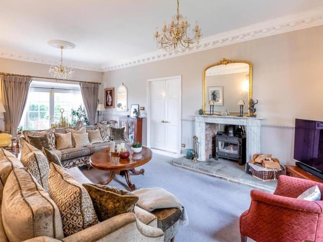 The lounge, with feature fireplace and multi-fuel burner.