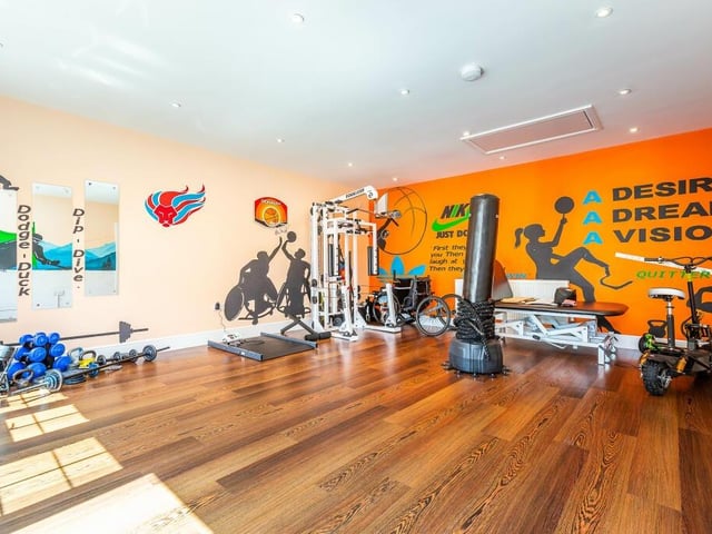 A large home gym is among the property's many facilities.