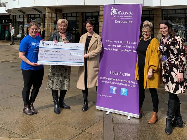The team from Lakeside Village presenting the cheque to Doncaster Mind