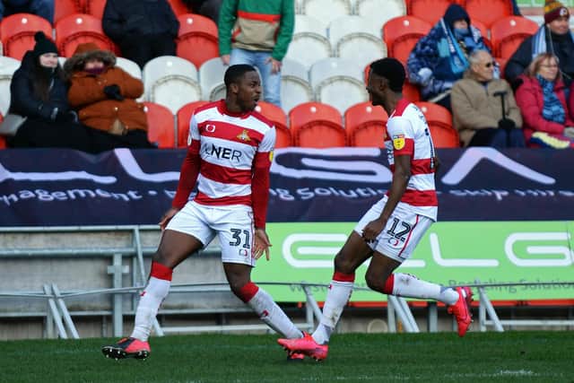 Niall Ennis celebrates his goal for Doncaster Rovers with Madger Gomes. Picture: Marie Caley