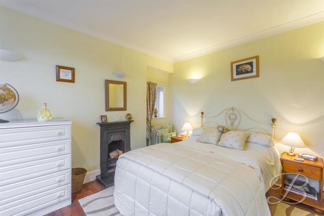 The third bedroom is full of character and even has its own feature fireplace. It also boasts a carpeted floor, central heating radiator and dual aspect windows.