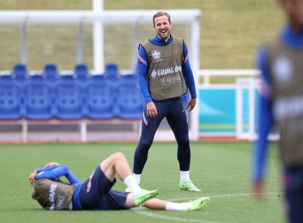 Harry Kane is all smiles during training. Photo by Catherine Ivill/Getty Images