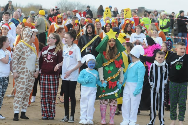 A Christmas tree, Smurfs and Santa hats all in one photo. But are you pictured at the 2014 dip?