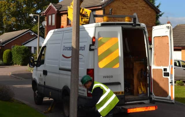A Doncaster Council worker installing new street lights