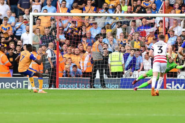 Mansfield's Lucas Akins scores from the spot to make it 3-1.