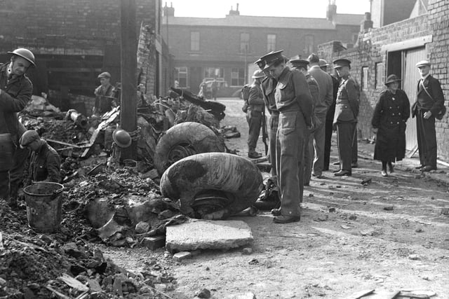 While the damage to Sunderland was huge, there were victories as well. In this September 1940 scene, spectators survey the wheels of a German bomber plane which crashed in a back lane in Suffolk Street.