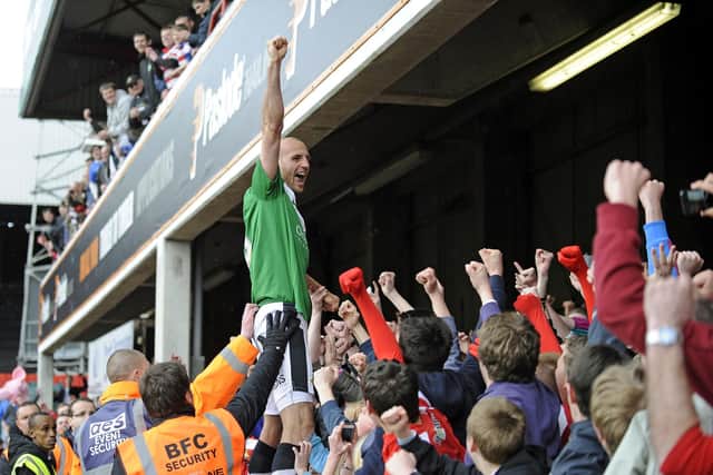 Rob Jones celebrates winning League One on the final day with Doncaster Rovers at Griffin Park, Brentford.