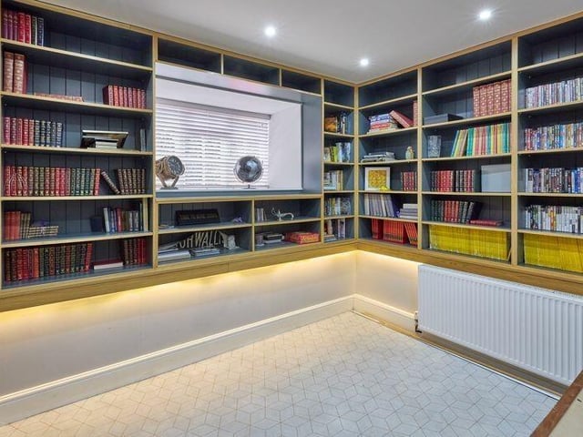 The home office, with bespoke shelving, was once an architect's studio.