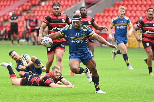 Jason Tali scores on his 100th Dons appearance. Photo: Howard Roe/AHPIX.com