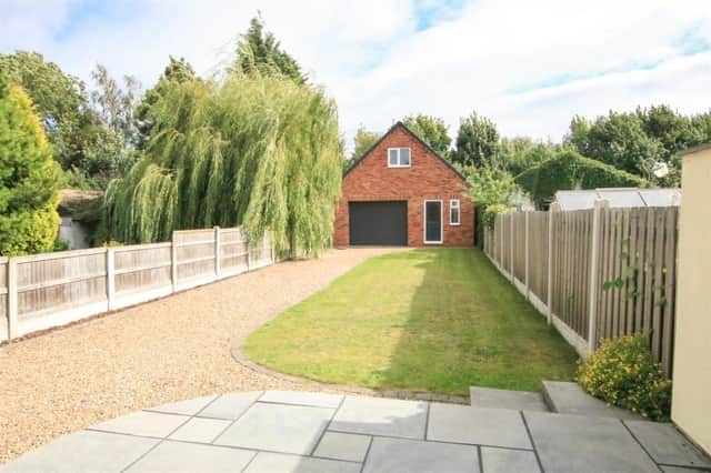 This two-storey garden building comes with the four-bedroom semi-detached home for sale in Sprotbrough