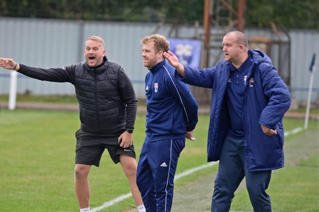 Rossington Main manager Ben Hunter, centre, with his coaching staff.