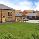 The front aspect of the stunning property for sale at £895,000.