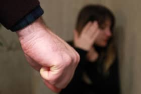 STOCK: Domestic violence illustration posed by a model.