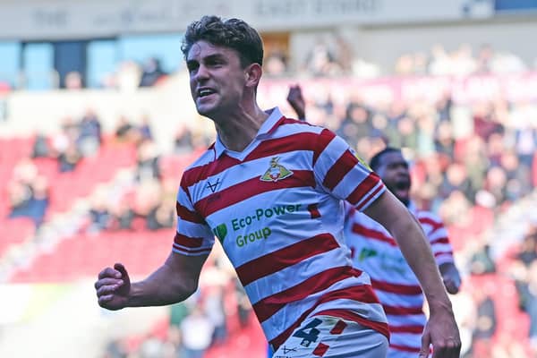 Harrison Biggins celebrates his goal.