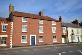 Front view of property with  traditional style solid wooden door finished in Royal Blue with decorative stained glass panels opens to the entrance hall.