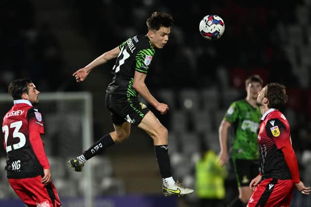 Liam Ravenhill wins the header. Picture: Howard Roe/AHPIX LTD