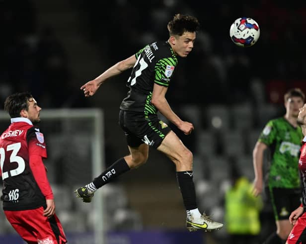 Liam Ravenhill wins the header. Picture: Howard Roe/AHPIX LTD