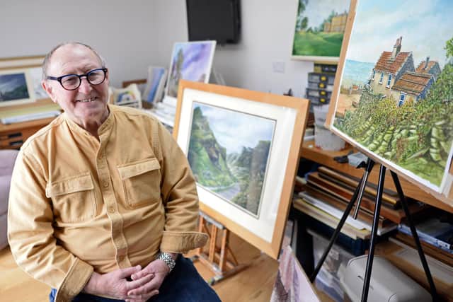 John Littlehales, pictured, with some of his Artwork.