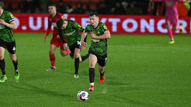 Doncaster's James Maxwell drives forward with the ball