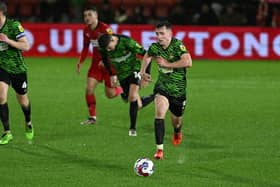 Doncaster's James Maxwell drives forward with the ball